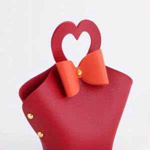 Кожанная подарочная сумочка для бижутерии и сувениров, красная с бантом, 10.5×5×6 см