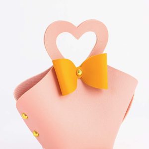 Кожанная подарочная сумочка для бижутерии и сувениров, розовая с бантом, 10.5×5×6 см